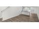 Open dining area with wood-look floors and kitchen view at 8658 Brixton Shay Dr, Raleigh, NC 27616
