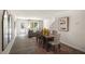 Bright dining area with wood table and access to the living room at 8658 Brixton Shay Dr, Raleigh, NC 27616
