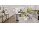 Open concept kitchen with island and a view into living room at 8658 Brixton Shay Dr, Raleigh, NC 27616