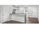 Modern kitchen with granite countertops and stainless steel appliances at 8658 Brixton Shay Dr, Raleigh, NC 27616