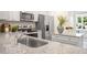 Modern kitchen with stainless steel sink and appliances, and granite countertops at 8658 Brixton Shay Dr, Raleigh, NC 27616