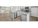 Modern kitchen with stainless steel appliances and granite countertops at 8658 Brixton Shay Dr, Raleigh, NC 27616