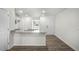 Kitchen with granite countertop and access to living room at 8658 Brixton Shay Dr, Raleigh, NC 27616