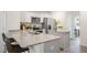 Modern kitchen with granite countertops, stainless steel appliances, and an island at 8658 Brixton Shay Dr, Raleigh, NC 27616