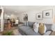 Open living room with hardwood floors, neutral walls, and stylish furniture at 8658 Brixton Shay Dr, Raleigh, NC 27616