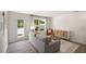 Bright living room with gray sofa and access to the outdoors at 8658 Brixton Shay Dr, Raleigh, NC 27616
