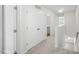 Upstairs hallway with linen closet and bathroom access at 8658 Brixton Shay Dr, Raleigh, NC 27616