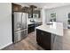 Modern kitchen with stainless steel appliances and island at 901 Arnold Place Dr, Fuquay Varina, NC 27526