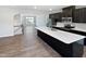 Open concept kitchen with island and access to living area at 901 Arnold Place Dr, Fuquay Varina, NC 27526