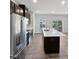 Modern kitchen with stainless steel appliances and island at 901 Arnold Place Dr, Fuquay Varina, NC 27526