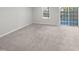 Bright living room with sliding glass doors to backyard at 901 Arnold Place Dr, Fuquay Varina, NC 27526