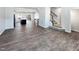 Open concept living room with hardwood floors and a view of the kitchen at 901 Arnold Place Dr, Fuquay Varina, NC 27526