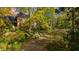 Brick house with driveway and autumn foliage at 906 Marlowe Rd, Raleigh, NC 27609