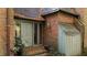 Side entrance with a green door and storage shed at 906 Marlowe Rd, Raleigh, NC 27609