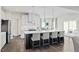 Modern kitchen with white cabinets, quartz countertops, and island at 1004 Country Pasture Cv, Wendell, NC 27591