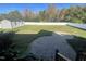 Large backyard with a patio, storage shed and privacy fence at 115 Hunterwood Pl, Benson, NC 27504