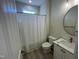 Clean bathroom with white vanity, a shower/tub combo and updated fixtures at 115 Hunterwood Pl, Benson, NC 27504