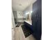 En-suite bathroom with double vanity and corner soaking tub at 115 Hunterwood Pl, Benson, NC 27504