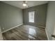 Bright bedroom featuring light walls and wood-look floors at 115 Hunterwood Pl, Benson, NC 27504