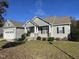 Gray sided ranch home with stone accents and landscaping at 115 Hunterwood Pl, Benson, NC 27504