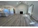 Open concept living area with kitchen, fireplace and LVP flooring at 115 Hunterwood Pl, Benson, NC 27504