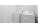 Laundry room with washer, dryer, and overhead shelving at 1823 Hinesley Dr, Durham, NC 27703