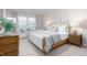 Spacious main bedroom with a king-size bed and wood dresser at 1823 Hinesley Dr, Durham, NC 27703