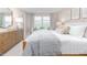 Bright main bedroom with a king bed and sitting area at 1823 Hinesley Dr, Durham, NC 27703