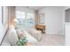 Relaxing sitting area with a sofa and ottomans near windows at 1823 Hinesley Dr, Durham, NC 27703