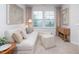 Cozy sitting area with a comfortable sofa and two ottomans at 1823 Hinesley Dr, Durham, NC 27703