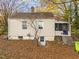 Side view of house with screened porch and steps at 307 Bickett Blvd, Raleigh, NC 27608