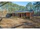 Front view of a brick ranch house with a neatly landscaped yard at 308 Santee Rd, Durham, NC 27704