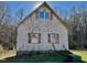 Rustic shed with ivy and red shutters at 340 Cedar Grove Dr, Henderson, NC 27537