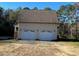 Detached two-car garage with white doors at 340 Cedar Grove Dr, Henderson, NC 27537