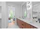 Modern bathroom with double vanity and a view of a home office at 511 S Bloodworth St # 103, Raleigh, NC 27601