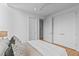 Spacious bedroom with a queen-size bed, double doors to a closet, and neutral tones at 511 S Bloodworth St # 103, Raleigh, NC 27601