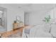 Bedroom with a dresser, a bed, and a view into the bathroom at 511 S Bloodworth St # 103, Raleigh, NC 27601