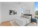 Bright bedroom with a comfortable bed, large windows, and stylish decor at 511 S Bloodworth St # 103, Raleigh, NC 27601