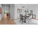 Bright dining area with modern table and chairs, hardwood floors at 511 S Bloodworth St # 103, Raleigh, NC 27601