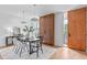 Modern dining room with wood table and chairs, hardwood floors at 511 S Bloodworth St # 103, Raleigh, NC 27601