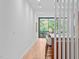 Light and airy hallway with wood floors and view to kitchen at 511 S Bloodworth St # 103, Raleigh, NC 27601