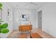 Home office with hardwood floors, a desk, and two ottomans at 511 S Bloodworth St # 103, Raleigh, NC 27601