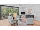 Bright living room with modern furniture and sliding glass doors leading to a balcony at 511 S Bloodworth St # 103, Raleigh, NC 27601