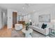Open living area showcasing a modern aesthetic and partial kitchen view at 511 S Bloodworth St # 103, Raleigh, NC 27601