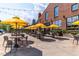 Outdoor patio with yellow umbrellas and seating at 511 S Bloodworth St # 103, Raleigh, NC 27601
