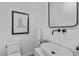Stylish powder room with modern sink and black framed mirror at 511 S Bloodworth St # 103, Raleigh, NC 27601