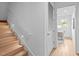 Modern light wood staircase with LED lighting and access to an office at 511 S Bloodworth St # 103, Raleigh, NC 27601