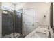 Bathroom with double vanity, large shower, and tile flooring at 516 Lemon Daisy Ln, Knightdale, NC 27545