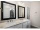 Double vanity bathroom with modern fixtures and mirrors at 516 Lemon Daisy Ln, Knightdale, NC 27545