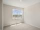 Bedroom with carpet and a large window at 516 Lemon Daisy Ln, Knightdale, NC 27545